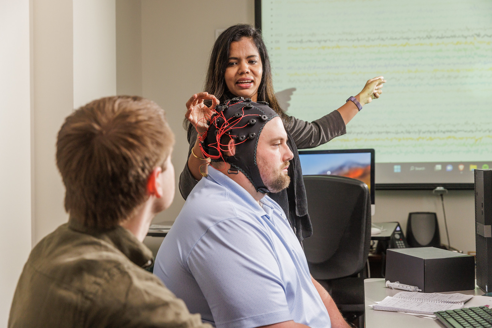 Dr. Cruz analyzing high-density EEG data