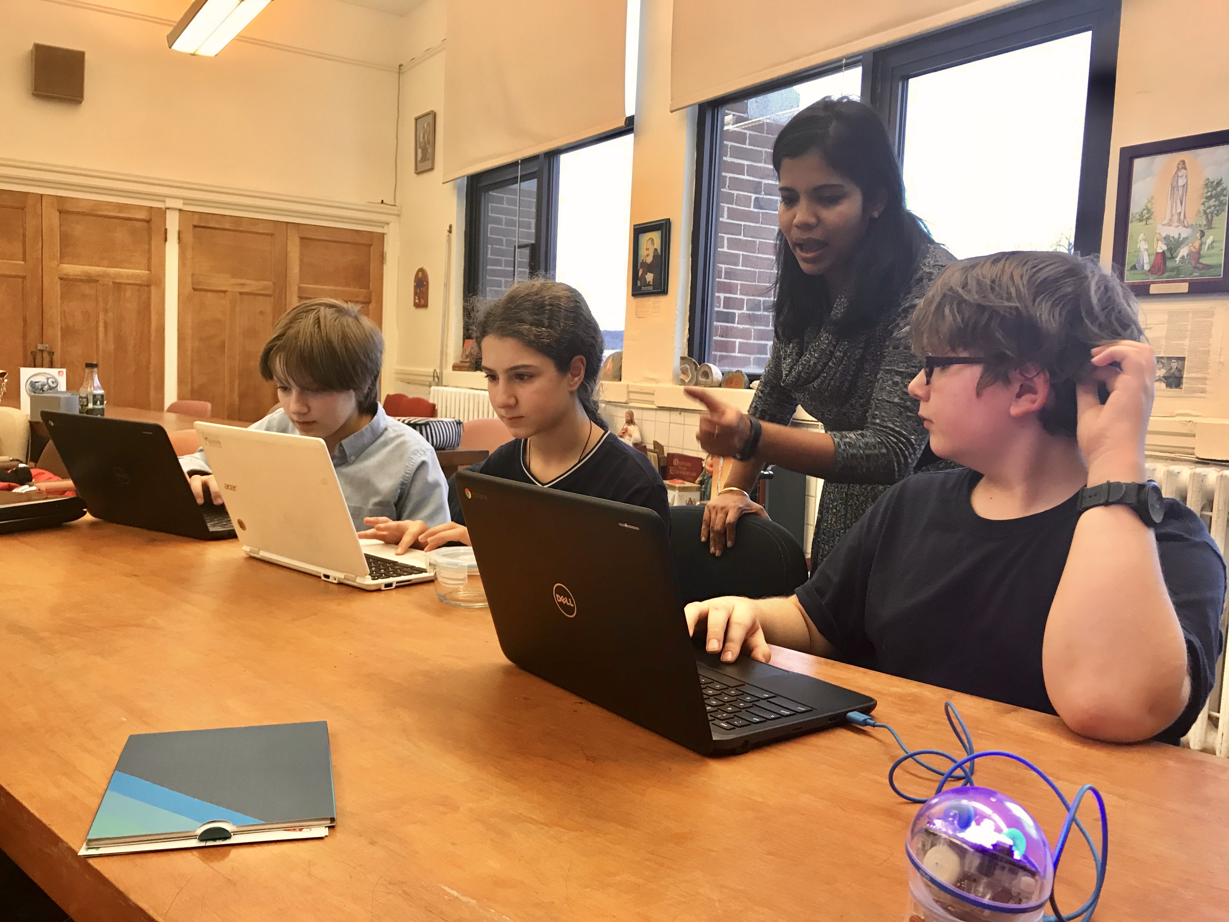Dr. Cruz teaching younger STEM students